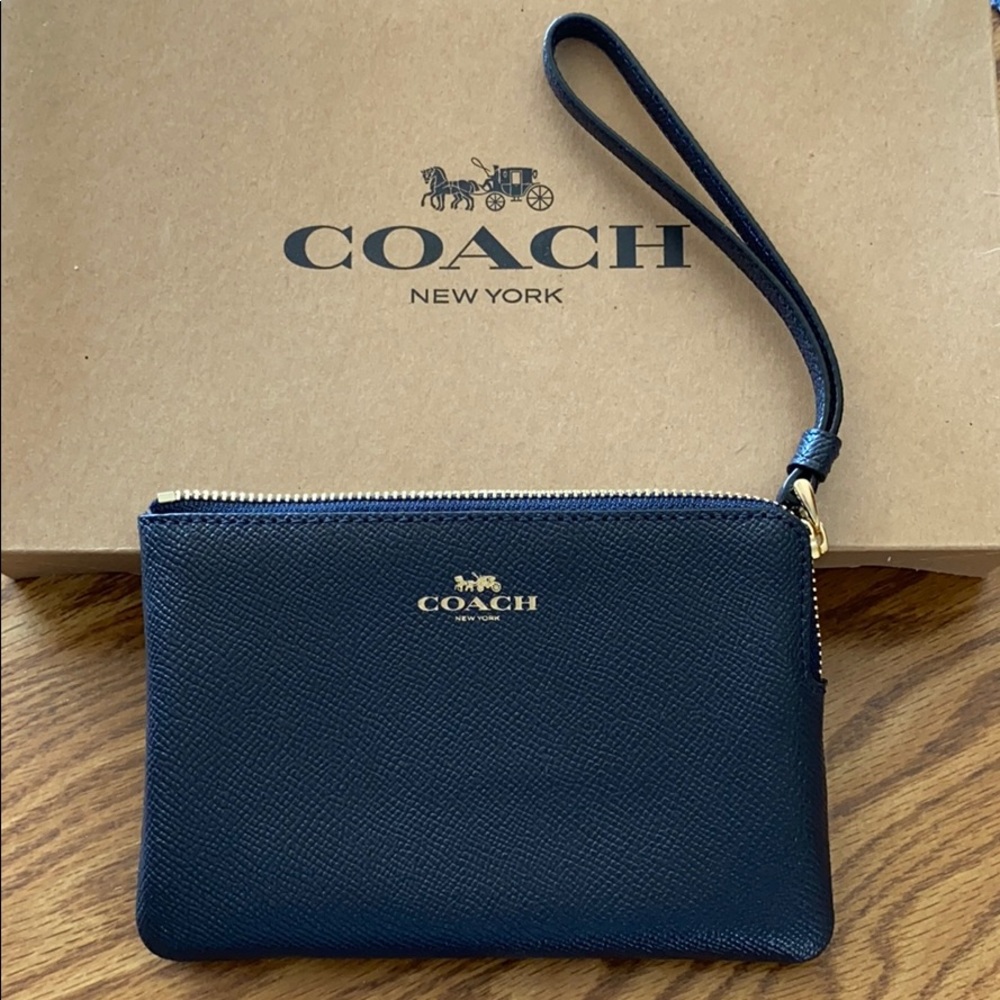 Coach midnight blue wristlet.